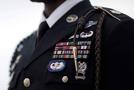 Capt. Sara Johnston, U.S. Army Reserve, exchanges a salute with her recruiter, Sergeant First Class Travis Morrisey. Johnston, a scientist at U.S. Army Medical Research Institute of Infectious Diseases, commissioned as a 71A (microbiologist) Jan. 27, 2023, in a Fort Detrick, Md. ceremony.